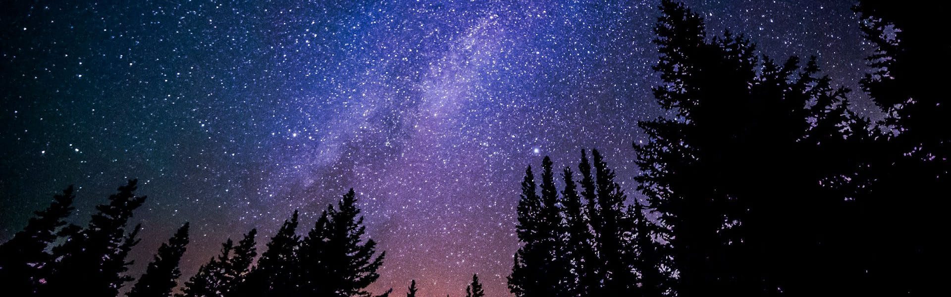 Starlit night sky representing trauma‑linked sleep therapy and gentle night‑time support