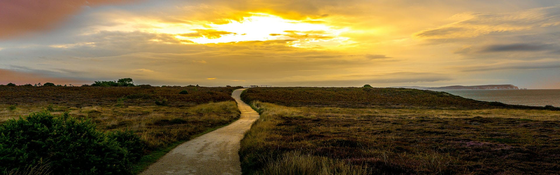 Winding path to sunrise symbolising healing growth and emotional wellbeing in therapy at Supportive Counselling Ltd