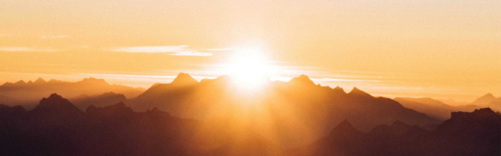Sunrise over mountains symbolising growth and improvement in mental health and therapy in York